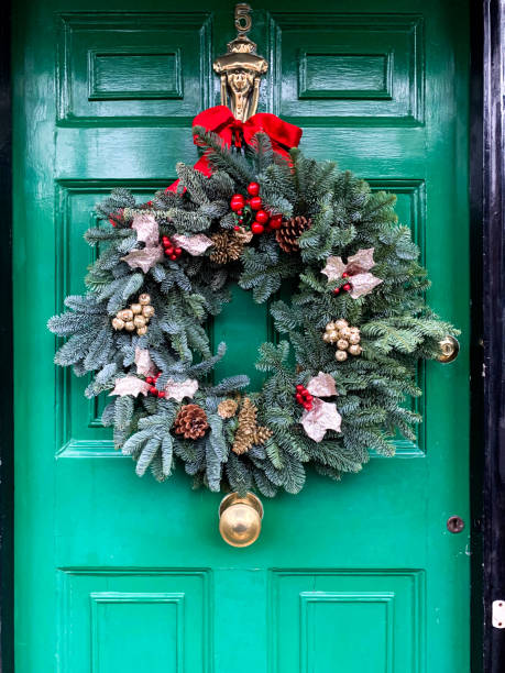 istock Christmas wreath on green door 1357865893