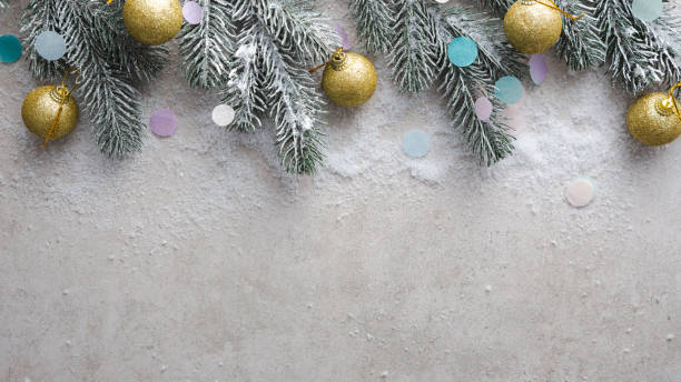 istock Golden Christmas decorations and snow on fir branches copy space 1357866192