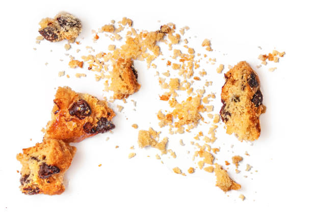 istock Chocolate cookies crumbs  isolated on white background. Top view 1357866995