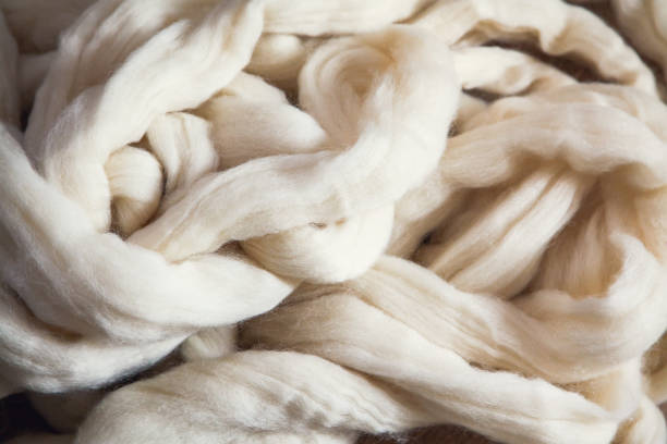 istock A pile of large-knit merino wool threads for knitting a plaid 1357867533
