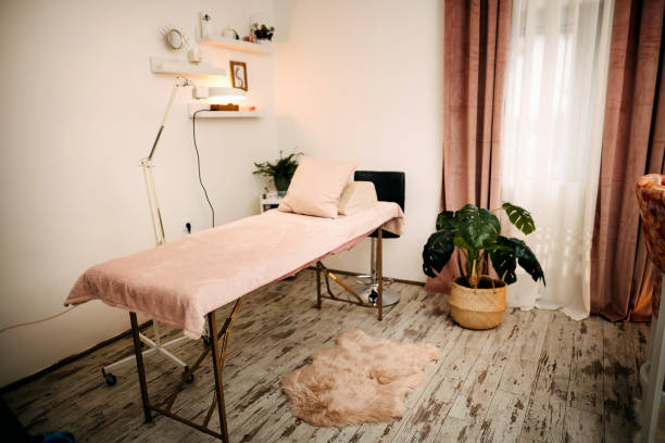 Treatment room with a bed in beauty salon.