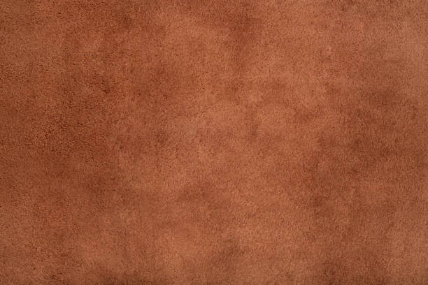 istock Brown suede leather texture background, genuine leather, top view. 1357868966