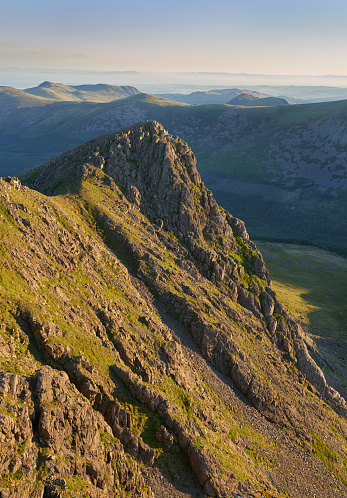 Sunrise over Ennerdale from Scoat Fell with views of Steeple In the English Lake District, UK.