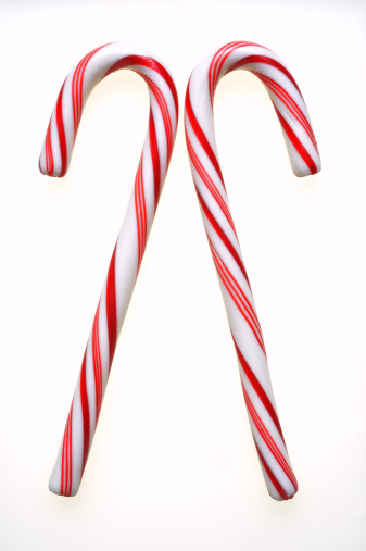 Twin candy canes on white background