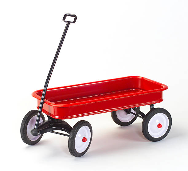 Classic child's Little Red Wagon on white with soft shadows stock photo