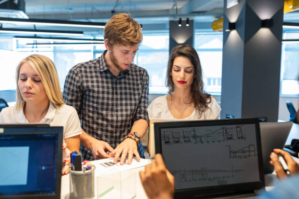 istock Young coworkers in modern office 1357873243