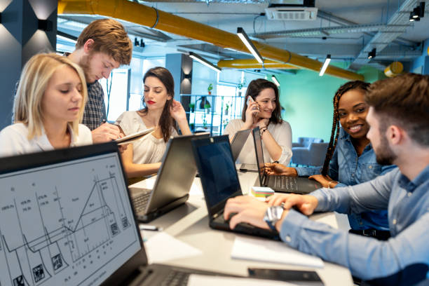 istock Young coworkers in modern office 1357873257