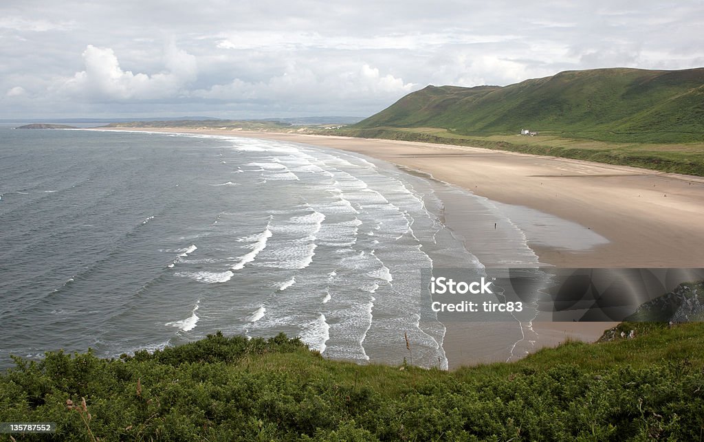Deserted beachscape Breaking Wave Stock Photo