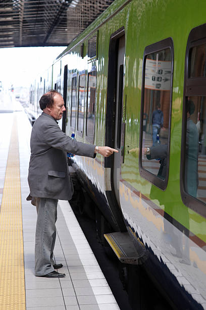 istock Man opening door to train 135787612