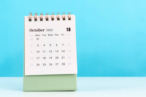 istock October 2022 desk calendar on blue background. 1357878333