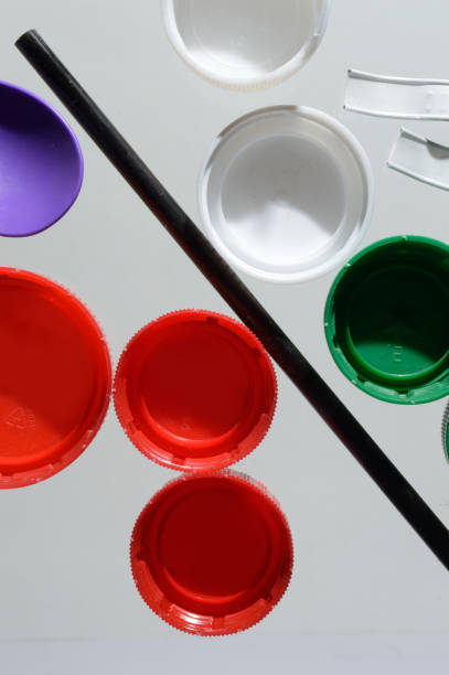 istock plastic waste bottle caps. close-up top view. 1357878335