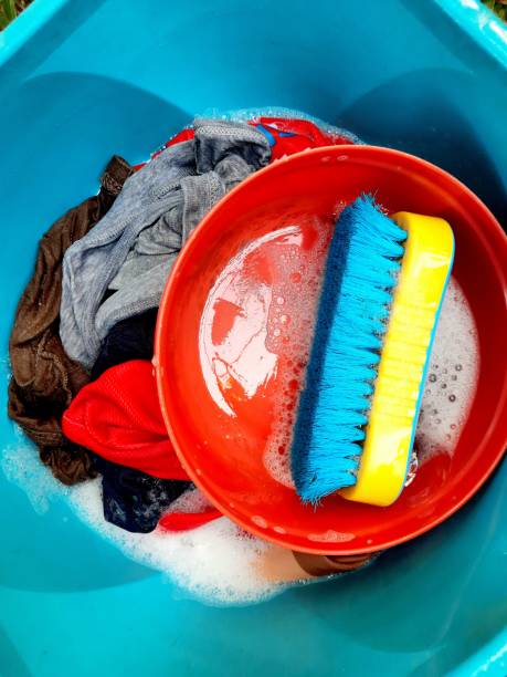 istock Washing Clothes in blue bucket. 1357878823