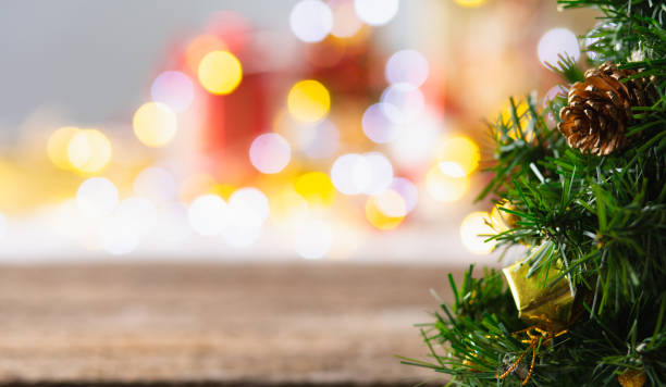 istock Wooden table and christmas lights background 1357879826
