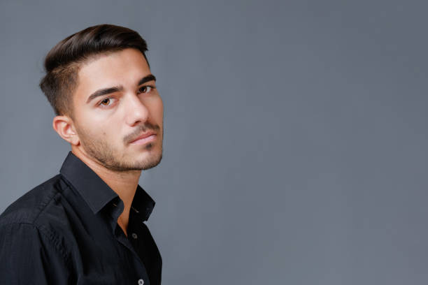 istock Close-up portrait of handsome serious guy 1357881640