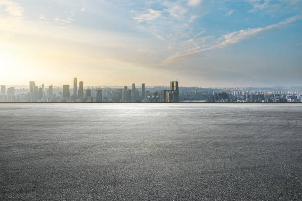 istock Panoramic skyline and modern commercial office buildings with empty road 1357882371