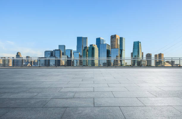 istock Panoramic skyline and modern commercial office buildings with empty road 1357882982
