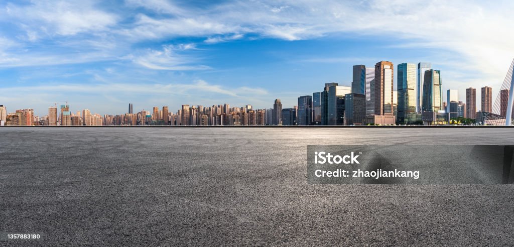Panoramic skyline and modern commercial office buildings with empty road Panoramic skyline and modern commercial office buildings with empty road. Asphalt road and cityscape. City Stock Photo