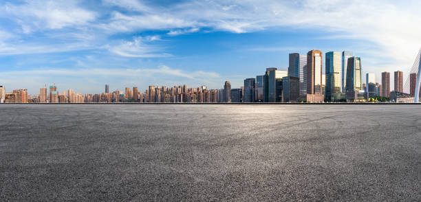 Panoramic skyline and modern commercial office buildings with empty road Panoramic skyline and modern commercial office buildings with empty road. Asphalt road and cityscape. panoramic street view stock pictures, royalty-free photos & images