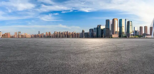 Photo of Panoramic skyline and modern commercial office buildings with empty road