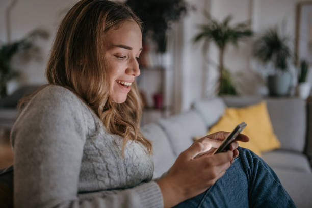 istock Woman relaxing on sofa 1357883670