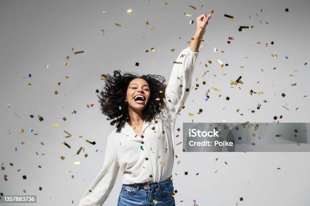 Beautiful Excited Woman At Celebration Party With Falling Confetti Stock Photo - Download Image Now