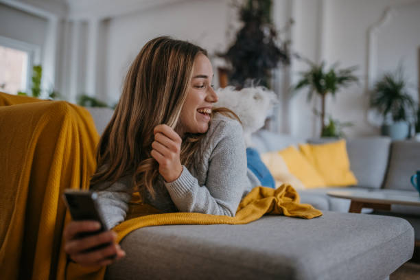 istock Woman relaxing on sofa 1357884980