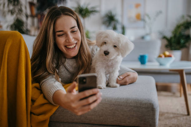 istock Woman relaxing with pet dog 1357885111