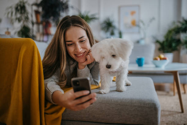 istock Woman relaxing with pet dog 1357885154