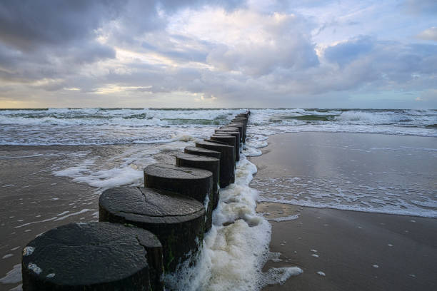 istock view over the bunes into the baltic sea at sunset. 1357886605