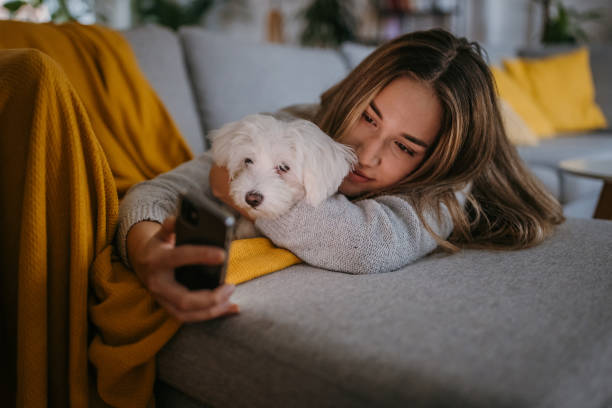 istock Woman relaxing on sofa 1357887311