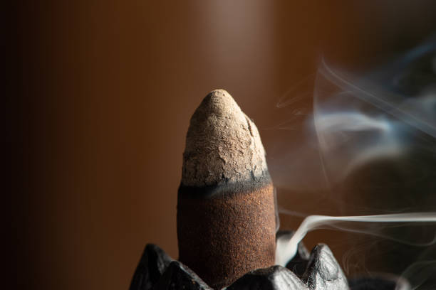 istock incense, incense smoke rising and creating beautiful shapes, Selective focus. 1357887759