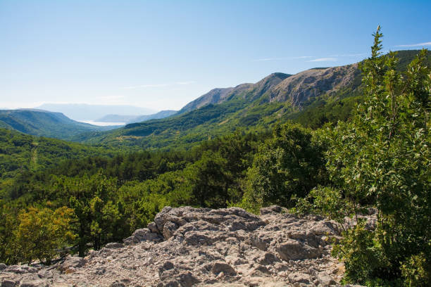 The landscape at the Treskavac Pass Panoramic Viewpoint in the Baska Valley on Krk island, in the Primorje-Gorski Kotar County of western Croatia. Looking towards Baska Bay in the distance