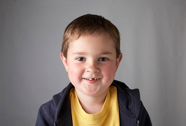 istock Four year old boy hoodie laughing 135788834