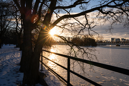 Sun rising over frozen Rideau River in Ottawa