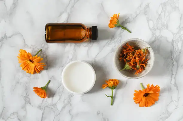 Photo of Skin care products with calendula flowers