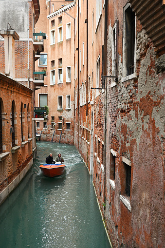 Venice, Italy - November 03, 2021: Old Town architecture and view to small canal in Venice, Italy