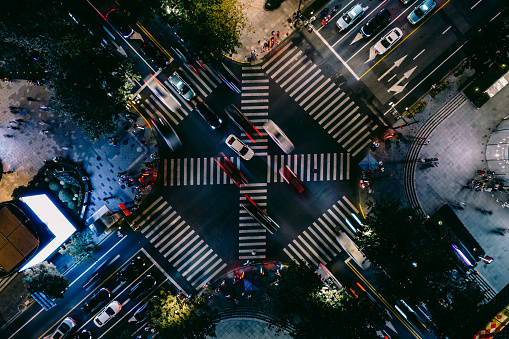 Drone Point View of City Street Crossing at Night