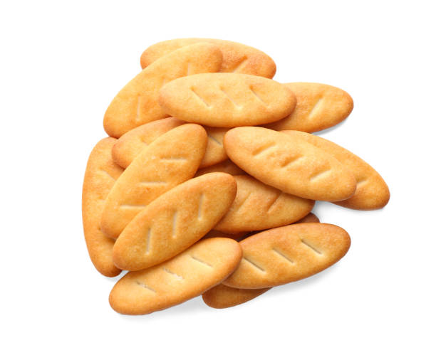 istock Delicious crispy crackers isolated on white, top view 1357890983
