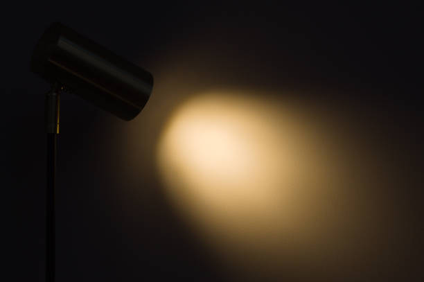 istock Lampshade with focused light on a table and wall 1357891842