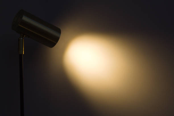 istock Lampshade with focused light on a table and wall 1357891852