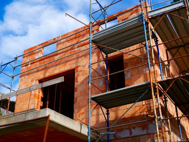 Construction site in the shell of brick walls