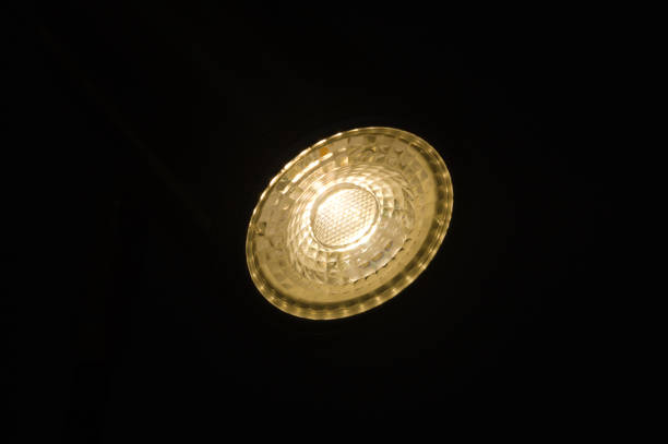istock Lampshade with focused light on a table and wall 1357891877