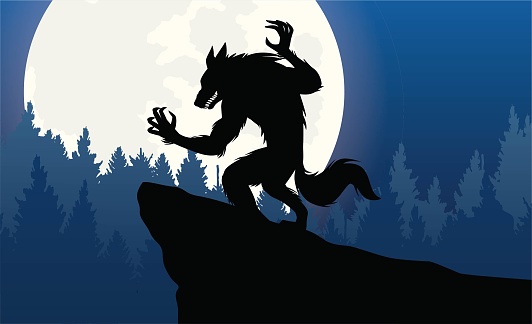 Silhouette of a werewolf agains the full moon.