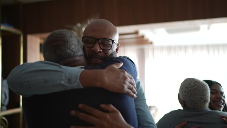 Father and son embracing at home during Christmas at home