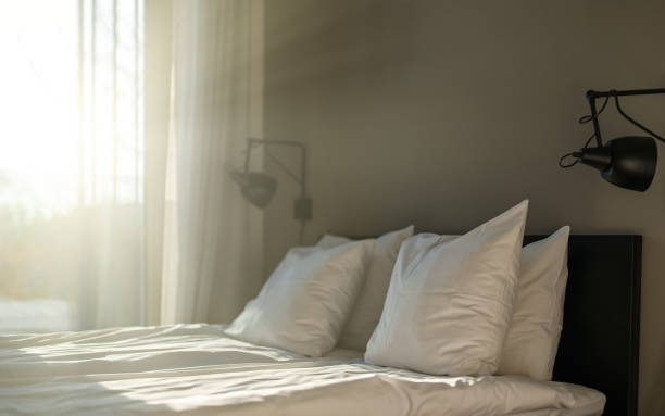 istock Bedroom is illuminated by the warm summer sun. 1357896225