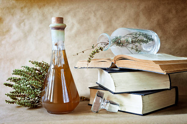 Herbal medicine Herbs in alternative medicine with books on vintage background ,still life alchemy photos stock pictures, royalty-free photos & images
