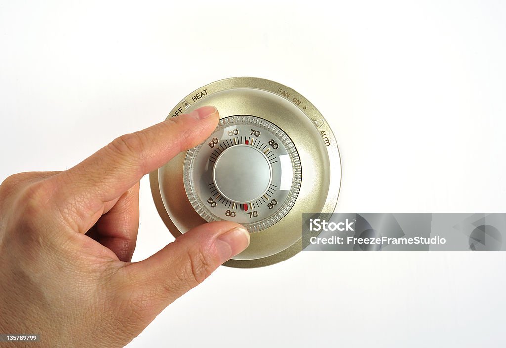 Ajuste de un termostato - Foto de stock de Celsius libre de derechos