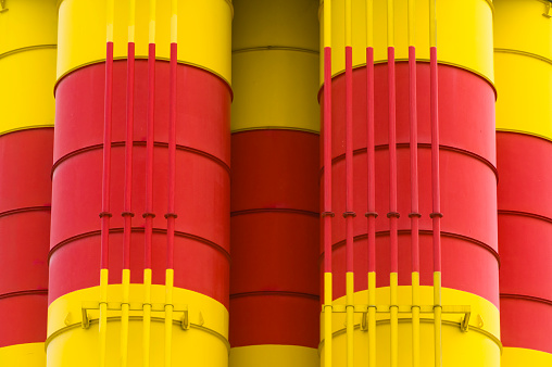 Detailed view of red-yellow painted silos