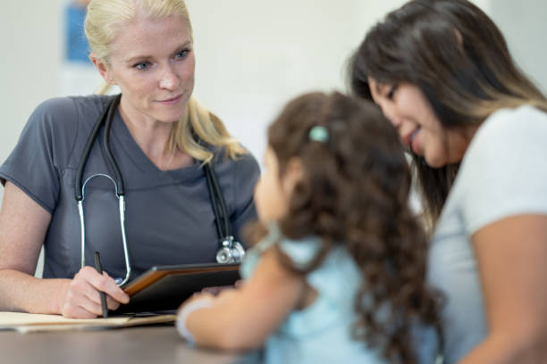 istock Mother and Daughter at the Doctors 1357900543