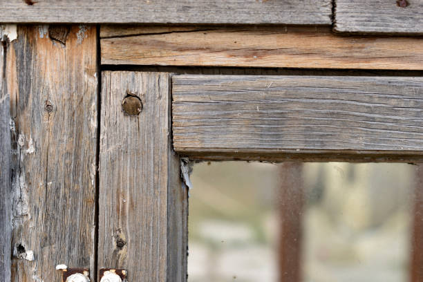 istock Old wooden painted rotten windows with glass 1357900690